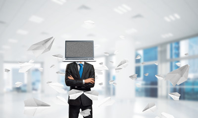 Businessman with laptop instead of head.