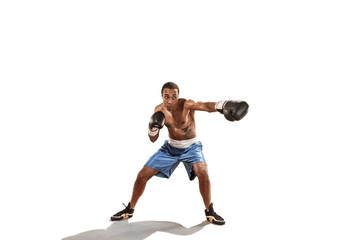 Sporty man during boxing exercise. Photo of boxer on white background