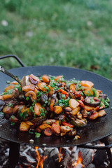 Roasting vegetables in outdoor. Preparation of food on a fire