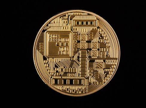 Coin bitcoin made of gold, isolated on a black background