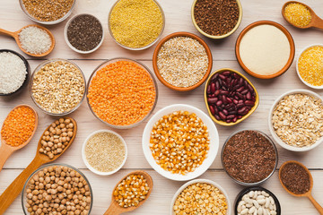 Cereals and legumes assortment on wooden table