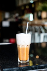 iced cappuccino coffee glass in cafe