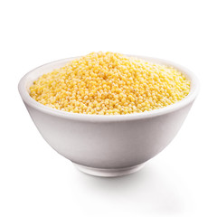 Fresh organic millet in bowl, Top view.