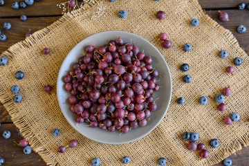 Fresh gooseberry on a plate. It can be used as a background