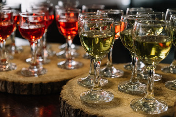 Many glasses of different wine on the table