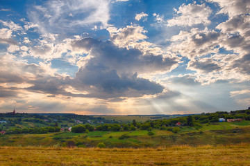 Fototapeta na wymiar Panorama of a beautiful countryside summer landscape at sunset