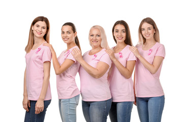 Fototapeta premium Beautiful women of different ages with pink ribbons on white background. Breast cancer concept