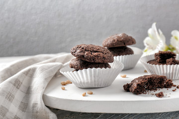 White wooden board with chocolate cookies
