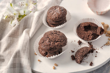 White wooden board with chocolate cookies