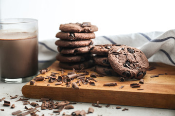Tasty chocolate cookies with cocoa drink on table