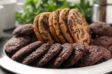 Tray with tasty chocolate cookies on table, closeup