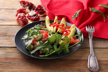 Tasty salad with ripe avocado on plate
