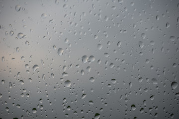The raindrops on glass of  a window