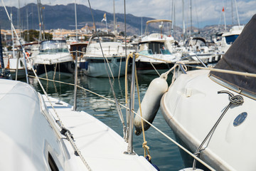Inside a sailing boat on a summer sun day at the marina about to take the helm and leave sailing...