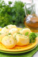 Boiled potatoes with fresh dill and oil