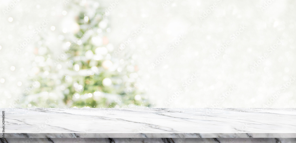 Aufkleber white marble table top at blur bokeh christmas tree decor with string light background when show fal
