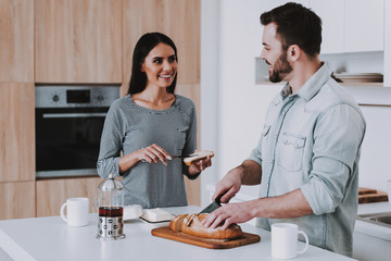 Young Couple Have Breakfast in Modern Kitchen.