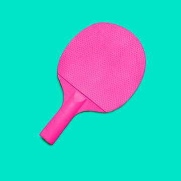 Pink Ping pong paddleson turquoise bakground. Fashion minimal art.