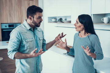 Young Couple Have Disagreement in Kitchen at Home.