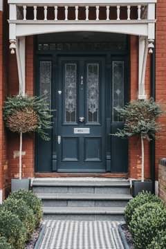 Colourful Stained Glass Wooden Door Of A Traditional Victorian House In London, UK. Stained Glass Remains A Focal Point In A Victorian Home.