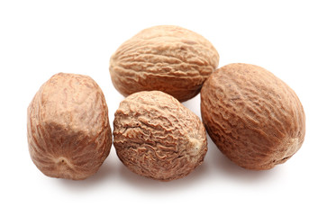Nutmegs on white background