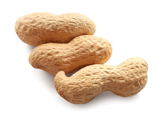 Unpeeled peanuts on white background
