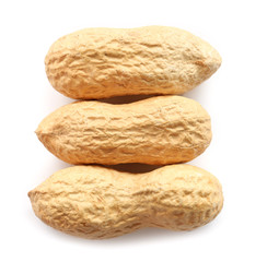 Unpeeled peanuts on white background