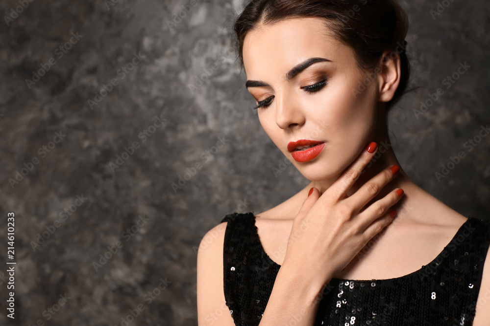 Poster young woman with beautiful manicure on dark background