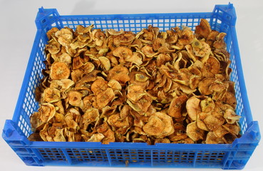 Blue plastic box with dried apples.
