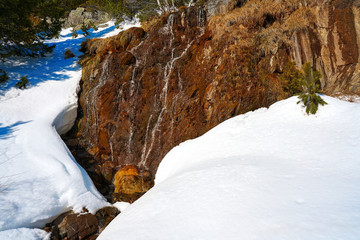 Fototapeta na wymiar Slate stone texture and snow in Pyrenees Spain