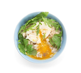 Bowl with delicious oatmeal, herbs and egg on white background