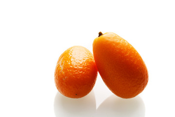 sliced kumquat on white background
