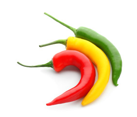 Fresh hot chili peppers on white background
