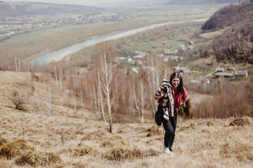 Naklejka premium beautiful stylish woman hipster hiking in summer mountains, travel concept, space for text