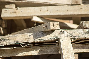 Fototapeta na wymiar Used wooden planks for carpentry in storage 