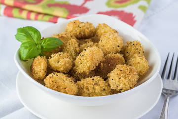 Baked crispy potato gnocchi with bread crumbs.