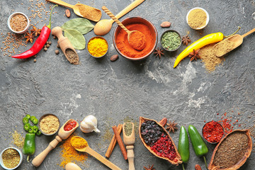 Composition with different dry spices on grunge background
