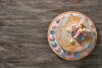 Fototapeta na wymiar Plate with delicious birthday cake on wooden background