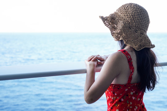 woman relaxing on Cruise ship enjoying ocean view from  balcony