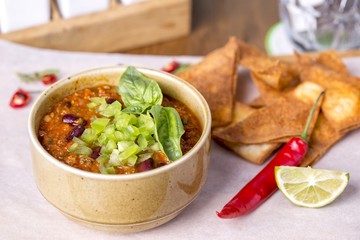 Chile  con carne soup with crispy bread. Spicy soup