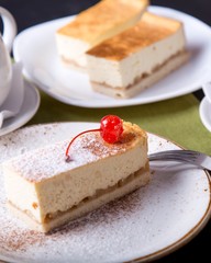 Tasty cheesecake on a platy. Sweet bakery with cherry