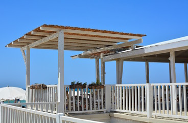 Wooden terrace at the beach, seafront view