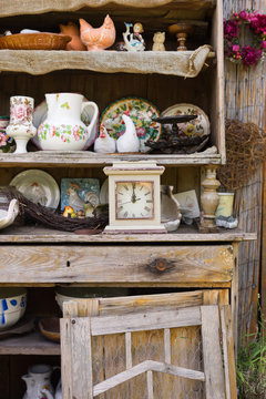 garden, kitchen tools and flowerpots on wood shelf