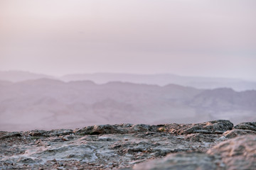 Sunrise in Israel dry negev desert. Amazing view on mountaines, rocks and sky. National park makhtesh ramon with beautiful landscapes