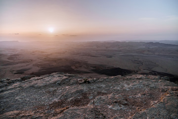 Sunrise in Israel dry negev desert. Amazing view on mountaines, rocks and sky. National park makhtesh ramon with beautiful landscapes