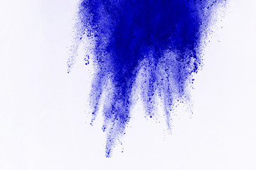 Abstract of blue powder explosion on white background. Blue powder splatted isolate. Colored cloud....