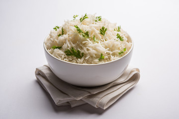 Coriander or cilantro Basmati Rice, served in a ceramic or terracotta bowl. It's a popular Indian OR Chinese recipe. Selective focus