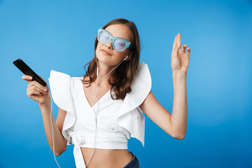 Portrait of a happy young girl in summer clothes