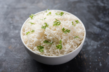 Coriander or cilantro Basmati Rice, served in a ceramic or terracotta bowl. It's a popular Indian OR Chinese recipe. Selective focus