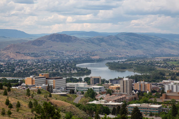 Fototapeta na wymiar Aerial view of Kamloops City during a cloudy summer day. Located in Interior BC, Canada.
